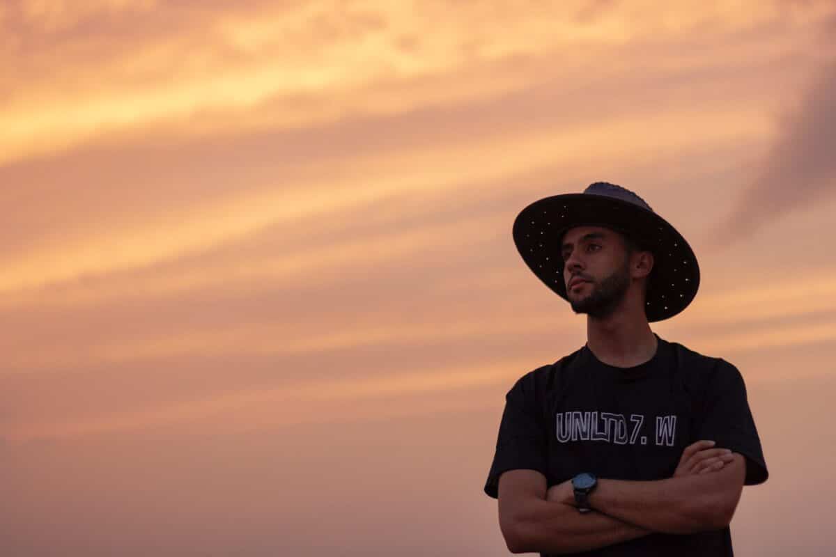 man in black cowboy hat and black crew neck t-shirt